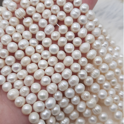 Перли натуральні, 7-8 мм., білий, овальний, нитка 35 см.
