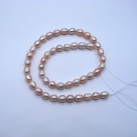 Жемчуг натуральный, 6-7 мм., розово-фиолетовый, овальный, нить 38 см.